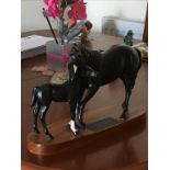 A Beswick Black Beauty and foal group on wooden base