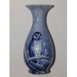 A porcelain vase painted in blue monochrome with an owl in a winter landscape – signed D.