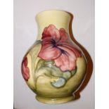 A Walter Moorcroft hibiscus pattern vase, with paper label '..Late Queen Mary', circa 1970,  9.5”