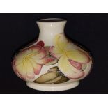 A Moorcoft frangipani squat vase by Emma Bossons, 1999,  5” diameter – some glaze crazing