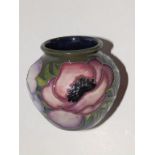 A boxed Moorcroft Anemone Tribute vase by Emma Bossons - 2002,  2.75”