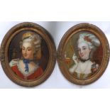 A pair of Victorian reverse oil paintings on convex glass – Bust length portraits of two fashionable