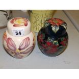 A Moorcroft Poinsettia ginger jar – 2002, 4.5” and a Frangipane ginger jar – 1999 (2)