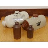 A Doulton stoneware footwarmer, one other and two Bourne Denby bottles (4)