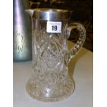 A silver-rimmed cut glass jug – Birmingham 1946, 8” high