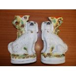 A pair of Victorian Staffordshire dog spill vases, 13” high – one cracked