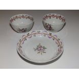 Two mixed pink ribbon porcelain tea bowls with matched saucer (3)
