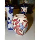 Two modern Moorcroft floral vases – 2001, 5” high and a 2004 Fuchsia vase, 3.5” high (3)