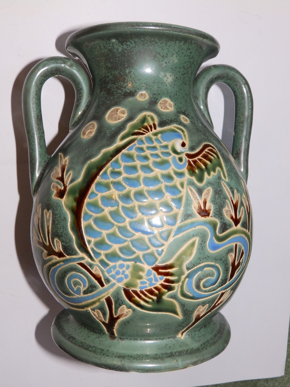 A two-handled vase decorated fish, 9.75” high