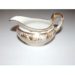 A Miles Mason floral gilded canoe shaped cream jug – P244