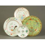 Four Chinese plates, polychrome.  Sizes from 6.5 ins to 11.5 ins.  CONDITION REPORT: The small plate