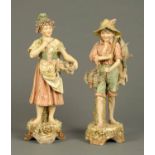 A pair of Royal Dux figures, fisher girl and hunter, each decorated in typical Dux colours and