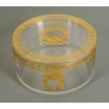 A late 19th century cylindrical glass bowl with cover, decorated with leaf and berry design.