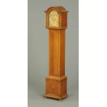 An oak cased granddaughter clock,