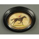 A miniature woven silk picture, horse and jockey.  2.5 ins x 3 ins, framed.