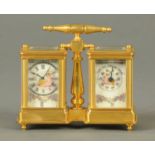 A combined barometer carriage desk timepiece, with centre carrying handle.  Height 4.5 ins, width 4.