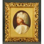 A 19th century Italian School oil painting on board, oval, portrait of a child.  9 ins x 6.