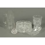 A cut glass fruit bowl, oval dish, cylindrical vase, small ovoid vase and etched glass water jug.