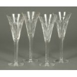 A set of four Waterford Crystal champagne flutes, each with faceted stem.  Height 9.25 ins.