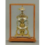 A brass skeleton clock, single fusee, with silvered dial,