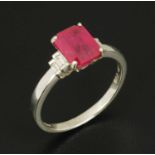 An 18 ct gold emerald cut ruby and diamond accent ring, size M (see illustration).