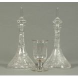 A large pair of ships type cut glass decanters, each with stopper, and an etched glass celery vase.