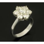 An 18 ct white gold daisy cluster ring, set with diamonds weighing 2.11 carats, size M.