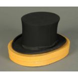 An Austin Reed folding opera top hat, size 7, Merino, in original box. CONDITION REPORT: The hat