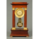 A late 19th century French mahogany portico clock, in the Empire style, with 5.