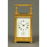 An Edwardian brass carriage clock, with alarm mechanism, of large form.  Height excluding carrying