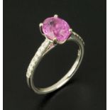 An 18 ct white gold Burmese pink sapphire and diamond ring, size M/N (see illustration).