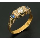 An 18 ct gold ring, set with a diamond to the centre and coloured stones to either side, size L.