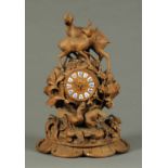 A Black Forest carved wooden mantle clock,