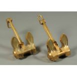 A pair of lacquered brass yacht anchors.  Height 20 ins (see illustration).