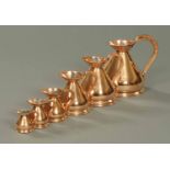 A set of six copper jugs, graduated, Victorian.  From 1/2 gallon to 1/8 gill (see illustration).