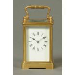 An Edwardian French brass carriage clock, two-train movement, Roman numerals.