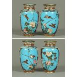 A pair of Japanese Cloisonne vases, decorated with birds and flowers to blue ground.  Height 7.5