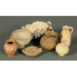 A collection of seven terracotta antiquities, Roman oil lamp, two jugs,