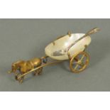 A 19th century salt, in the form of a horse and cart, brass and mother of pearl.  Length 3.5 ins.