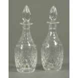 A pair of cut glass decanters, each with stopper.  Height 12 ins.