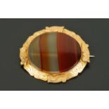 A carnelian brooch, in 9 ct gold mount.  55 mm x 45 mm (see illustration).