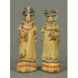 A pair of mid 19th century carved painted wooden figures, believed to have been carved in Beccles