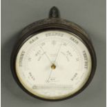 A late 19th century Wilson of Carlisle aneroid barometer, circular, with thermometer.  Diameter 9.