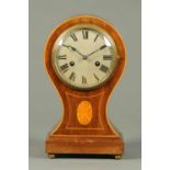 An Edwardian inlaid mahogany mantle clock, with two-train striking movement.