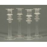 A set of four Venetian glass candlesticks, hand blown, with integral sconces.  Height 7 ins.