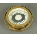 A ships compass, brass, with gimbal.  Diameter 9.5 ins.