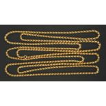 A 9 ct gold guard chain, stamped "9 ct" to one link.  Length 72 ins, 42.3 grams (see illustration).