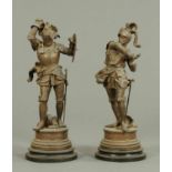 A pair of spelter knights, each raised on a circular plinth.  Height 28.5 ins.