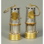 Two Eccles miners lamps, The Protector Lamp & Lighting Company.