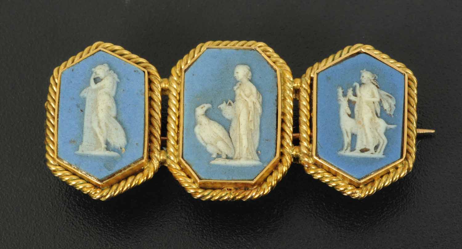 A 19th century blue Jasperware triple cameo brooch, with cameo to both sides,